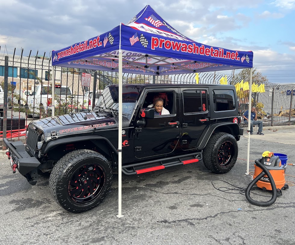 Customer in a black Jeep Wrangler during a hand wash at Pro Wash in Northeast Washington DC